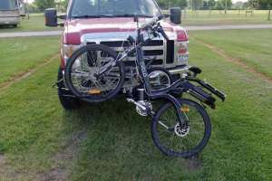 That bike's heavy, and I have to load it one wheel at a time. Thank God I don't use a top tube carrier any more, where the whole bike has to go up at once!