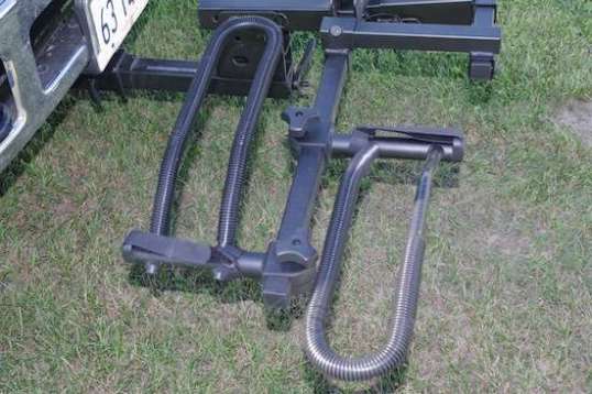 The hoops slide easily and then clamp to fit just bout any conventional bike or e-bike. I added a wrap of electrical tape and wiring protector to slow down paint loss and rust. The Ibex lays right in top of the hoop on the left.