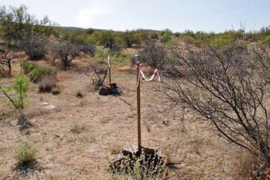 Three poles with cans and ribbons, for what purpose I never figured out.