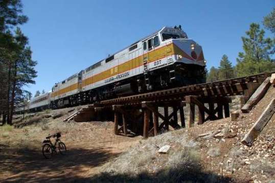 Add another order of magnitude of unexpected! The Grand Canyon tour train! That has to be some unique ride. It must have had nearly a dozen passenger cars, and most had people waving to me, so I did my best to look like a colorful character, and waved back. Now I know how Queen Elizabeth felt.