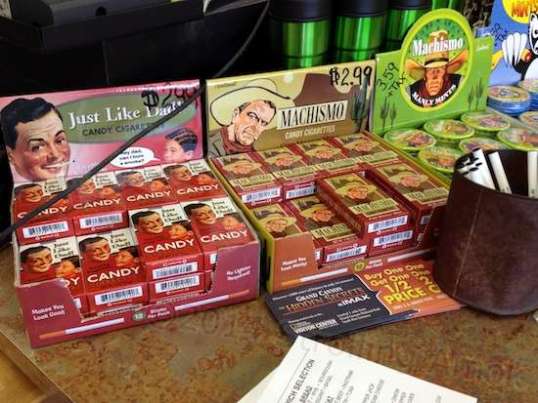 I was astounded to find these in the sandwich shop - candy cigarettes! "Makes you look cool! No lighter required! Hey dad, can I bum a smoke?" And the Maschismo brand says, "Makes you look manly!" On the right, Machismo also offers "Manly Mints".  At $2.99 per 12-pack, that puts these on a cost par with the real thing! I'd assumed these died out in the 1960s.