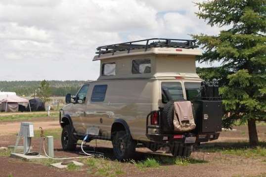 A Sportsmobile 4x4 in the campground, not the show. Sportsmobile was present as a vendor, and they have an enthusiastic following. That rear bumper and storage is by Aluminess.