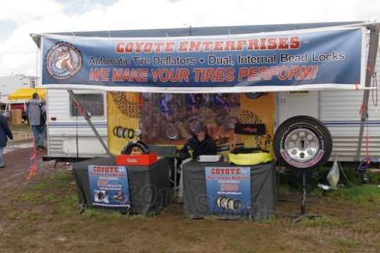This guy had two items of interest to me. Tire deflators and bead lock systems. Huh? The Mighty Furd's tires must be at 70-80 PSI for pavement use. that is tooth-jarring when offroad, especially when crawling slowly. It also ruins traction on loose surfaces. If you screw a tire deflator onto the tire valve, it takes pressure down quickly to a preset value of your choice, with no playing with a tire gauge to get it sorta right. It can get you unstuck, but you must air back up when returning to sustained higher speeds. These simply prevent the game of accidentally undershooting the pressure you wanted.