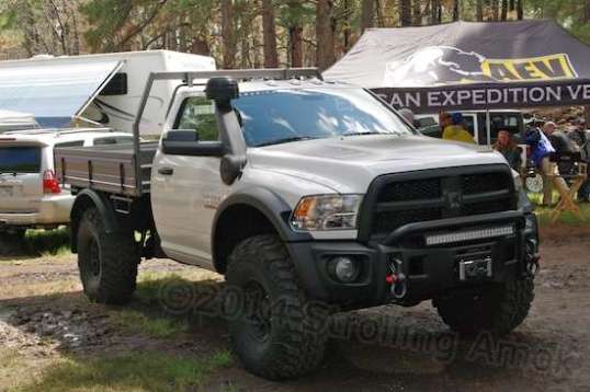 In this case, I had to smile. Image is everything. But I really liked it. That's an aluminum flatbed with removable sides. Dodge Ram, looking good. It has the appearance of an almost-stock Ram with a bed delete and big tires, but trust me, there's a big wad of money tied up in this thing.