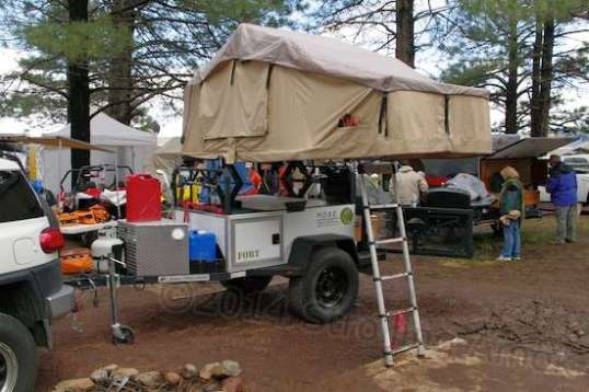 Crazy, man! This tent is raised up for storage access on stabilizer jacks. I wouldn't care to be up there in a 60 MPH wind, but these things aren't meant for full-time use no matter what comes.