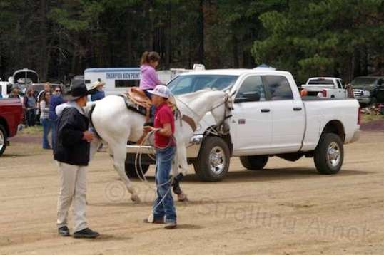 The little girl in lavender rode up and down the area, looking as content and everyday as could be.