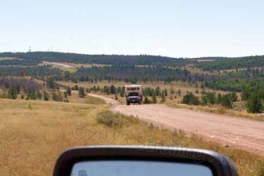 On my way out, this truck camper was very slowly lumbering up the trail, and I lucked into a service side trail that ran at an angle, and backed into it to let the camper by.