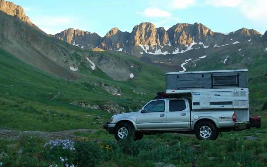 Nice camp. Some owners do this bed overhang thing. Gives me the willies, personally. Get into an emergency lane change at 70, and you'd better hope your suspension mods and shock absorber status are exceedingly hearty.
