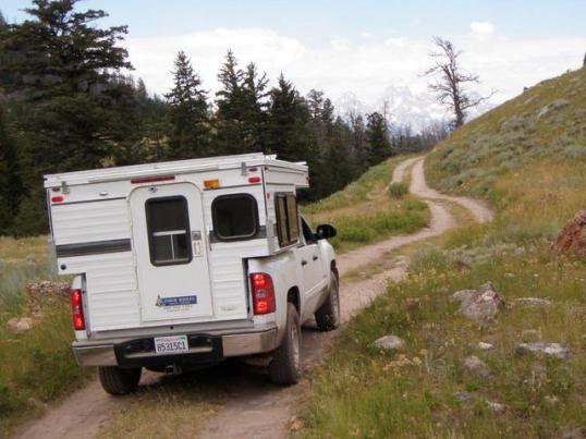 Nearly ANY truck camper can take this trail. The issue here is your confidence level toward whatever it does on the other side of that hill. On a trail, what's past is not a reliable indicator of what's ahead.