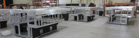 The Four Wheel build floor. The four rectangles in the black sidewalls are access holes for tie-down points to the truck bed. Perhaps someday they may progress to three in order to remove a lot of the effects of bed twist on the camper frame, but that is much, much more easily said than done: a complete redesign with lots of problems to solve. Worth it? Not really.