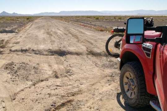You need to stay awake on this less interesting return south. The distance from the mountains makes for vast slopes to gather rain and aim it toward the mud flats. This is one of the deeper ones, but even the ripples are jarring in the F-250. The trip north ran between 20-45 MPH. This half was like rush hour traffic: crawl to 10 MPH and back to crawl, over some 20 miles.