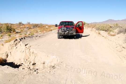 Whoopsie! This is one serious erosion crossing. It comes to the center of the trail, and you can bet that I hugged the "left" border for fear that Tubby's 8,500-9,000 pounds would not collapse the surrounding dirt wall. It was a litte close for my taste.