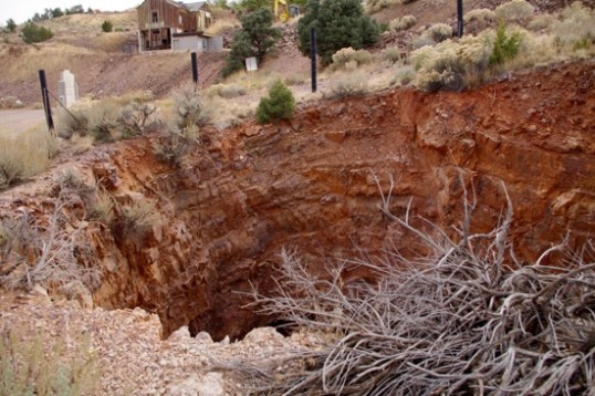A mine on the outskirts of town. It's hard for me to imagine the drop, but I've read that they hit water at 2,100' down, and had no practical way to pump it out. Today, it's a question of will and money.