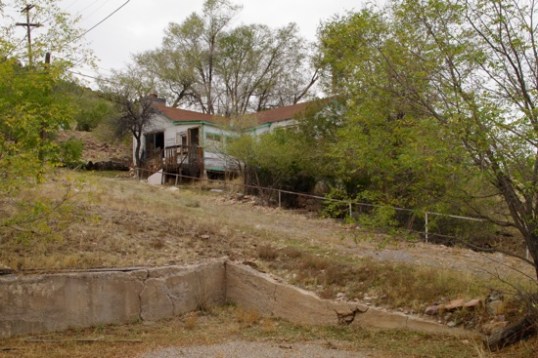 I suspect that a records search at the county assessor's office would be interesting. None of these abandoned homes are for sale, so what gives? At least it has a driveway of sorts, but without any level section to park on.