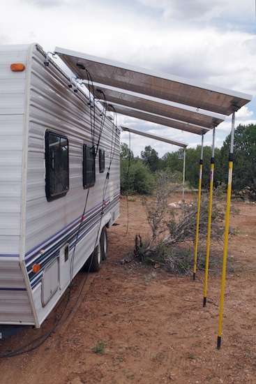 The Defiant's big residential panels pump out 195 watts at 18 volts nominal, taking care of business. But each is too heavy for a pop-up roof, and too big to stow just anywhere. :-(