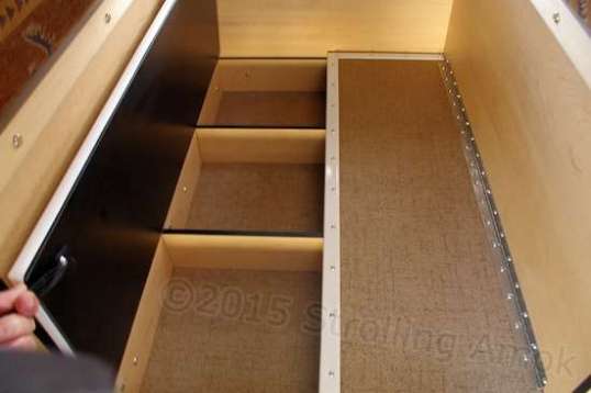 This was a complete surprise. The leg area under the table is a flat bin perfect for folded clothing. Might want to shed shoes here because of the split, because any step up to get into the loft bed is best done cans grit-carrying shoes anyway.