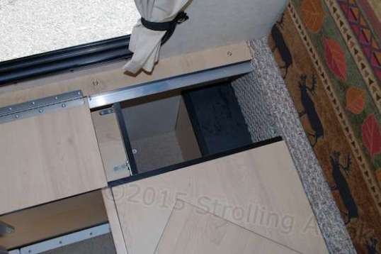 Just forward of the passenger bench is a funky little covered hole. Maybe they intended that to hold my tripod, or an umbrella.