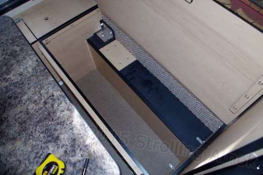 Storage underneath each of the bench seats is generous but compromised by clearance for the truck's fender wells. This is the passenger-side bench. It's exactly 36" long, which is exactly the length of three of my AGM batteries. I'll try it once just for sport, but realistically, they will have to be packed in on end. That will be a major convenience issue, but only when replacement time rolls around. Terminal access and basic weight will be the issues.