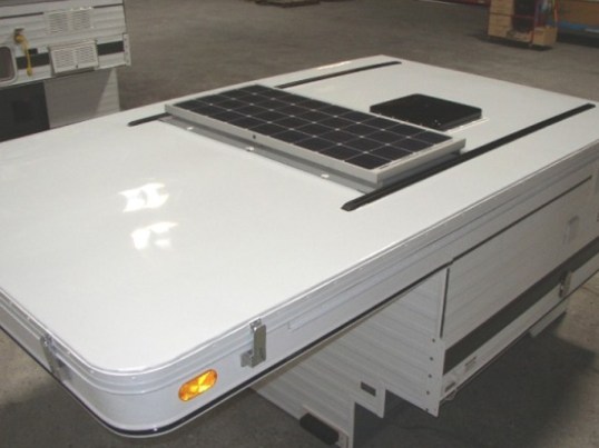 This is FWC's older 100-watt option. Notice the end-to-end panel support and the sealant buttered over the six mounting screws.