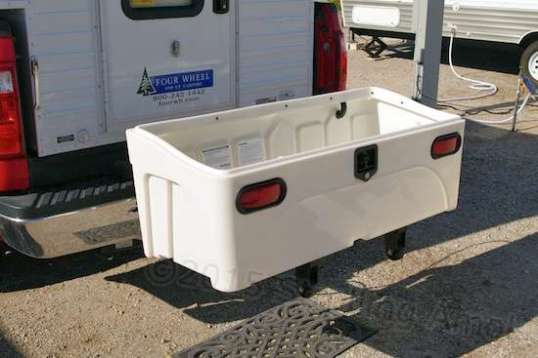 Set the box in place, align its four bolt holes to the frame's, and drop the bolts in.