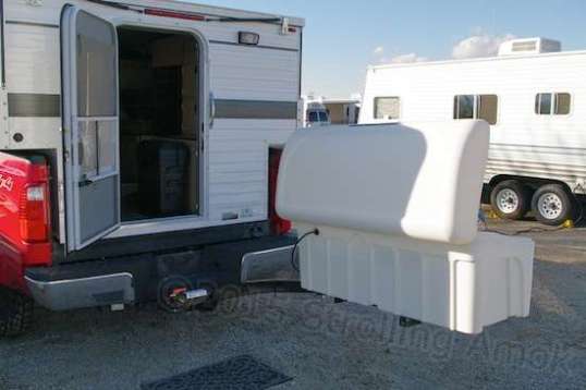 Voila! This shows the generous clearance that the swing-out frame provides to getting at the camper's door. The carrier's frame is an inch or so higher than the first bumper step and makes entry a little clumsier, but it's not so bad that I'm going to do anything about it until I've lived with it for awhile.