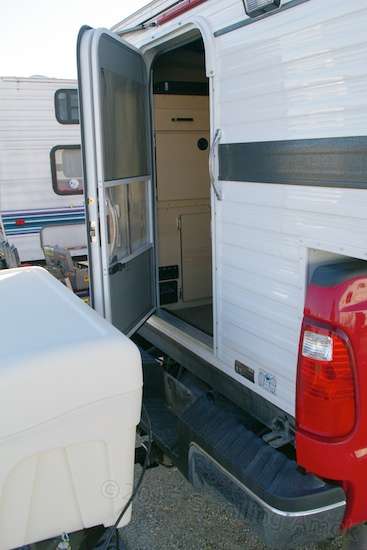 Unexpected bonus: there's just enough gap to allow entry into the camper without having to swing out the box first, which opens up overnight parking possibilities at rest stops and the like. It also removes the temptation for practical jokers to close the opened arm and lock me inside the camper at such stops.