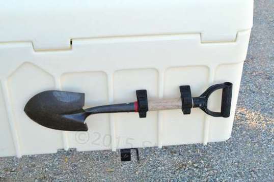 And here's the first true mod!! But, it's just a bolt-on. These Quick Fist rubber clamps require just one hole each to mount to the box with screws and nuts. I naturally added a fender washer on the inside. They look and act like rubber, but since they claim to be UV resistant, they may instead be urethane.