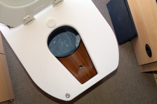 Seat up, and you can get an idea of what's expected of you. The C-Head is a sit down-only device, guys, unless you just love wiping things and entire areas off.