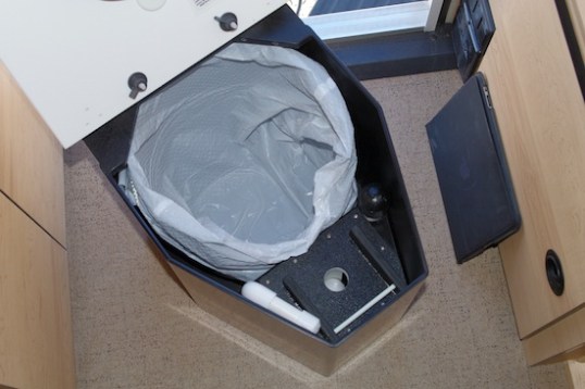 Below the hinged deck, it's all business down in here.