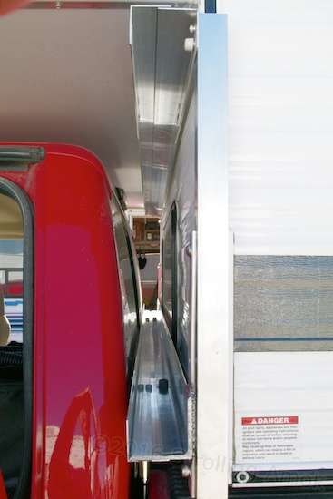 This is what the solar panels see before sliding in. Each panel must be inserted in the forward track, over the lower button. The UHMWPE tape that eliminates sliding friction is clear and difficult to discern here. A third bolt at the center of the jack plate has not yet been installed, but what you see here is basically it.