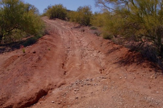 Start right, cross over to the left and stay there. Up ahead is a stretch of solid rock, then tons of loose rocks.