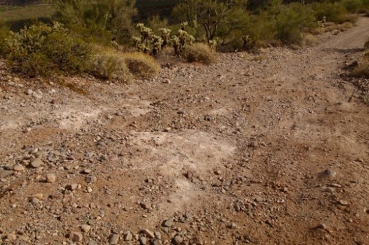Photographing a difficult section from above didn't show depths easily able to bend the main stem of the front bike carrier. Looking through the lens flattens it all out.