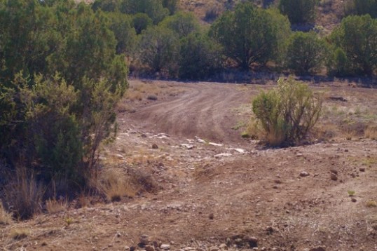 Looking from the CLOSED sign back to 638 reveals an interesting water erosion effect. Behind me were tons of scattered rocks the size of baseballs, laying on the dirt.