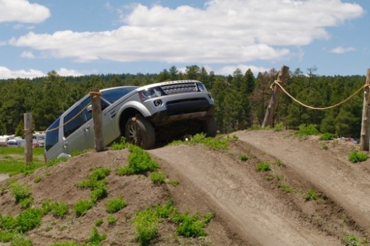 Attendees who buy the more deluxe weekend passes get to drive new Land Rovers through the advanced driving course, and they can take their own rigs as well, if approved for suitability. All are accompanied. This rise has to be spooky since even with those marker poles, you can't see anything but sky until you're heading downhill. Naturally, in the real deal, you'd be getting out beforehand to scope the situation out on foot.