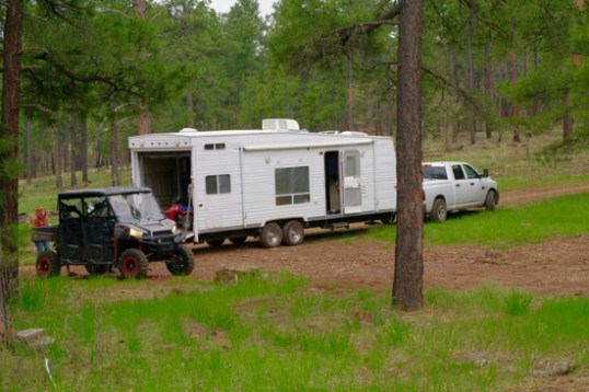 This toyhauler arrived in the early evening, and had to park awhile due to an overheating transmission. This was his second stop onroute, he told me. It's an older 2WD Dodge, and an hour later, impending darkness and threatening sprinkles of rain prompted a "now or never" departure. This climbing trail gets pretty bad when the dirt and rocks turn slippery, so the sprinkles served as a motivator to get rolling again.