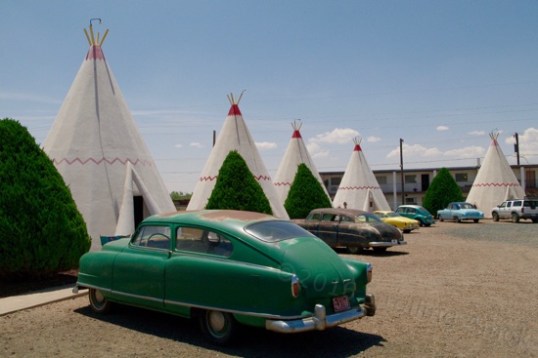 Even though these old cars are here for effect, there's still plenty of parking room. i noted that the teepees are in fact smooth-finished concrete painted over, and that one "flap" houses a window air conditioner. Now I suspect that these might not be real teepees.
