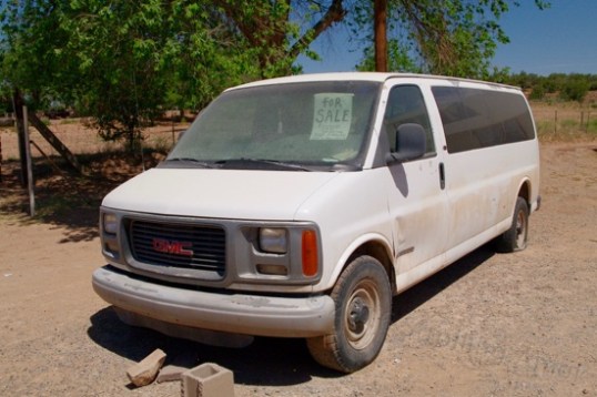 Wow, a 1997 1-ton Chevy passenger van parked out in front of a church, and they want just $1,000 for it! I noticed that it's been here a good long time, maybe because the sign says "bad motor".