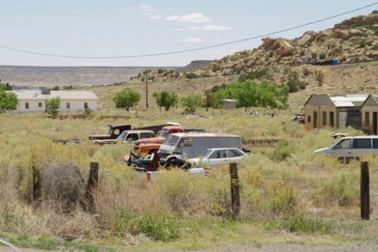 Beside Bud's is an interesting collection of dead vehicles.