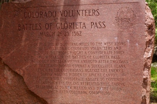 This one was put up by the Colorado State Historical Society in 1993, to "balance" the commemoration. The movement was begun by a politico who saw the first plaque, and wanted to mount something honoring the fallen Colorado Volunteers. The plaque notes the pitched two-day battle, adding that a flanking move to capture Confederate supply wagons resulted in their withdrawal. It also ended the threat to Colorado's gold mines.