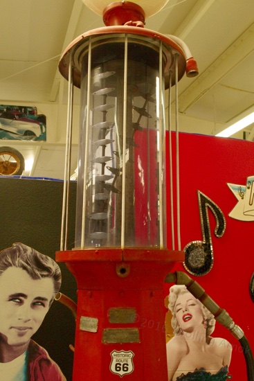 Early gas pump! This one started with a full bowel, and markers in the inside showed how many gallons were lost during the gas tank fill.