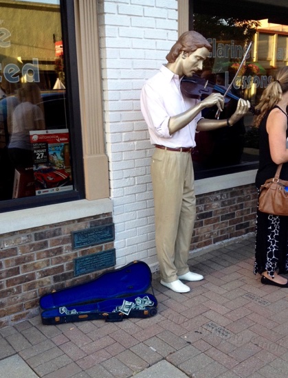 This one is parked in front of a real music store, something I haven't seen in decades galore.