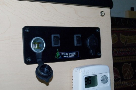 Twin switched 12V outlets, with covers.