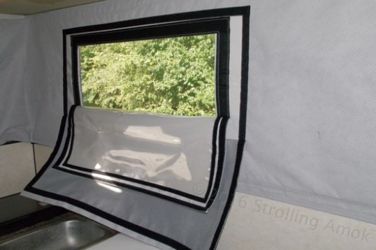 Wow! All these flaps can be held up off the counter simply by pulling the Arctic Pack's corners up just enough to attach them via the Velcro. The smallest flap is clear to allow light in without rain, the next is for privacy, and the next is to aid the Arctic Pack's insulating abilities.