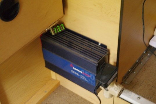 I recommend wiring an inexpensive digital DC voltmeter to your battery to get a rough idea of its state of charge. This one is simply perched on top of a Samlex 150-watt pure sine inverter, which allows even sensitive electronics to run safely. It uses less than 6 watts at idle by itself. Since Samlex recommended 10-gauge wire for my length of hookup wire, that's what I used. No unpleasant surprises.