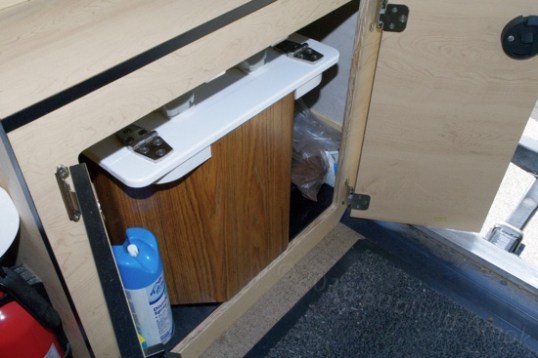 The C-Head BoonJon inside the Grandby's ear passenger-side cabinet.