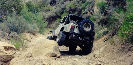Find an obstacle and conquer it! That's why he didn't keep to the right one more foot, and simply drive around this boulder.